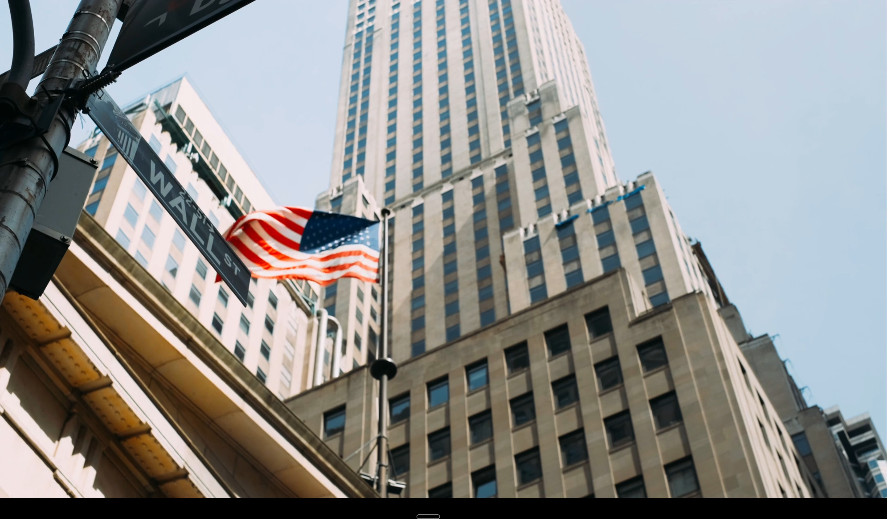 Wall Street architecture and American flag